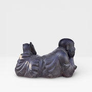 Reclining monk statue