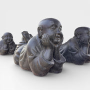 Reclining monk statue