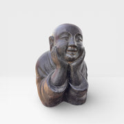 Reclining monk statue