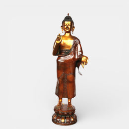 Bronze standing Buddha statue