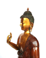 Bronze standing Buddha statue