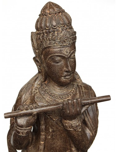 Statue of Krishna playing the...