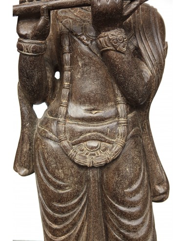 Statue of Krishna playing the...